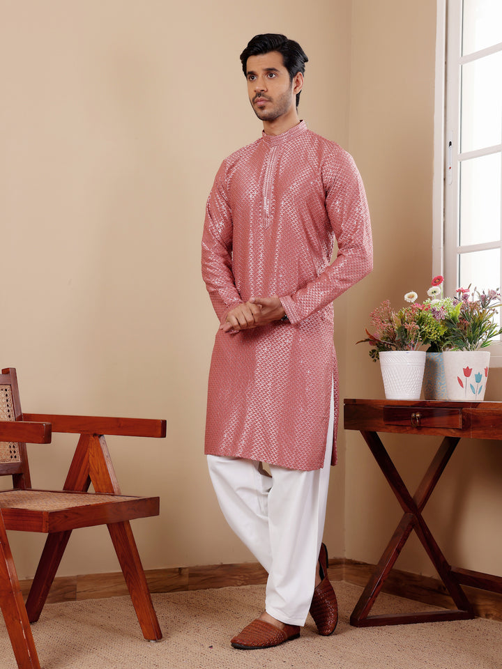 Men’s pastel red kurta with fine embroidery and breathable viscose fabric.