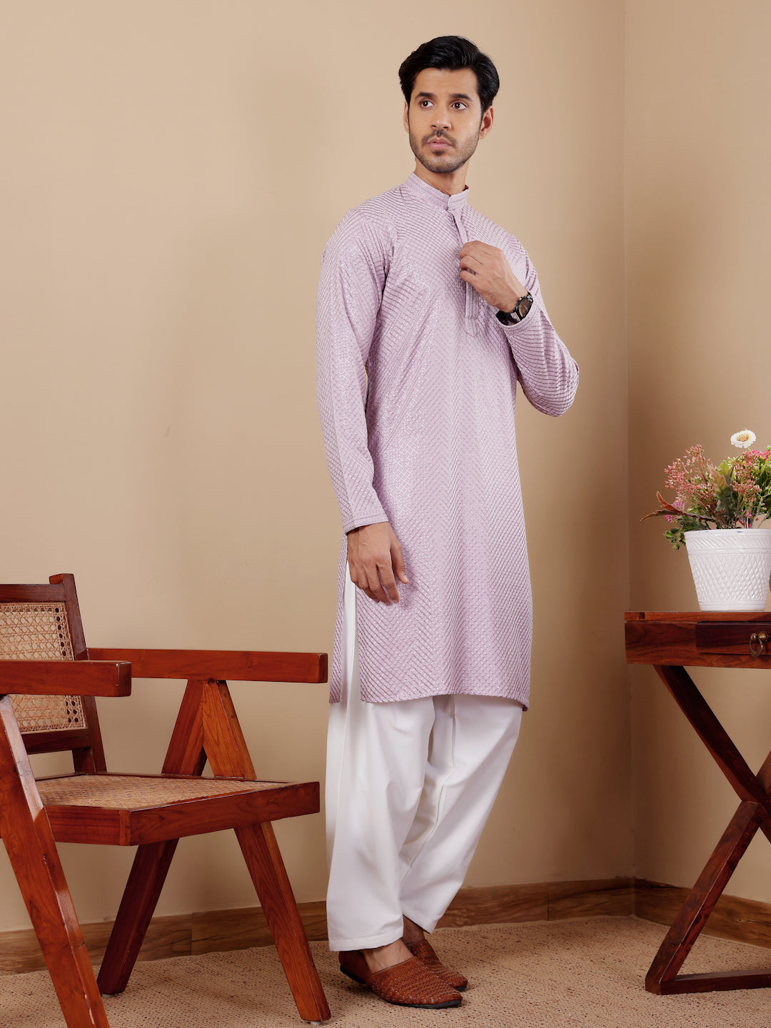 Sophisticated lavender kurta set for men, enhanced with Chikankari embroidery and art silk bottoms.