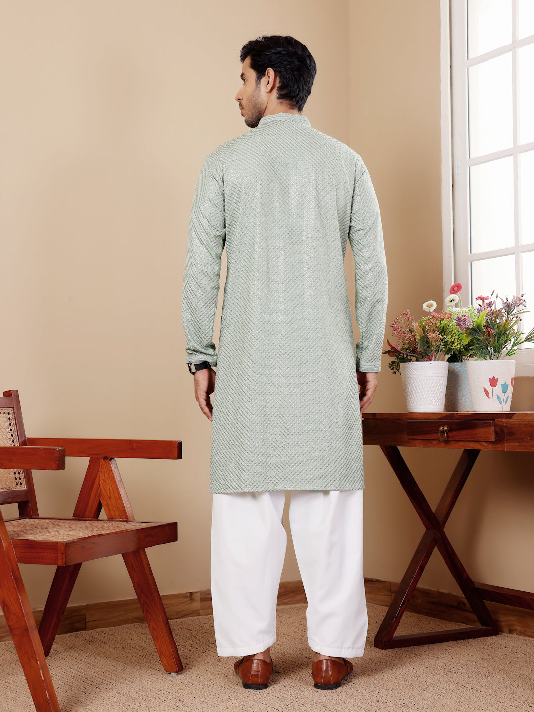 Light pastel green kurta set for men with Chikankari embroidery and art silk bottoms.