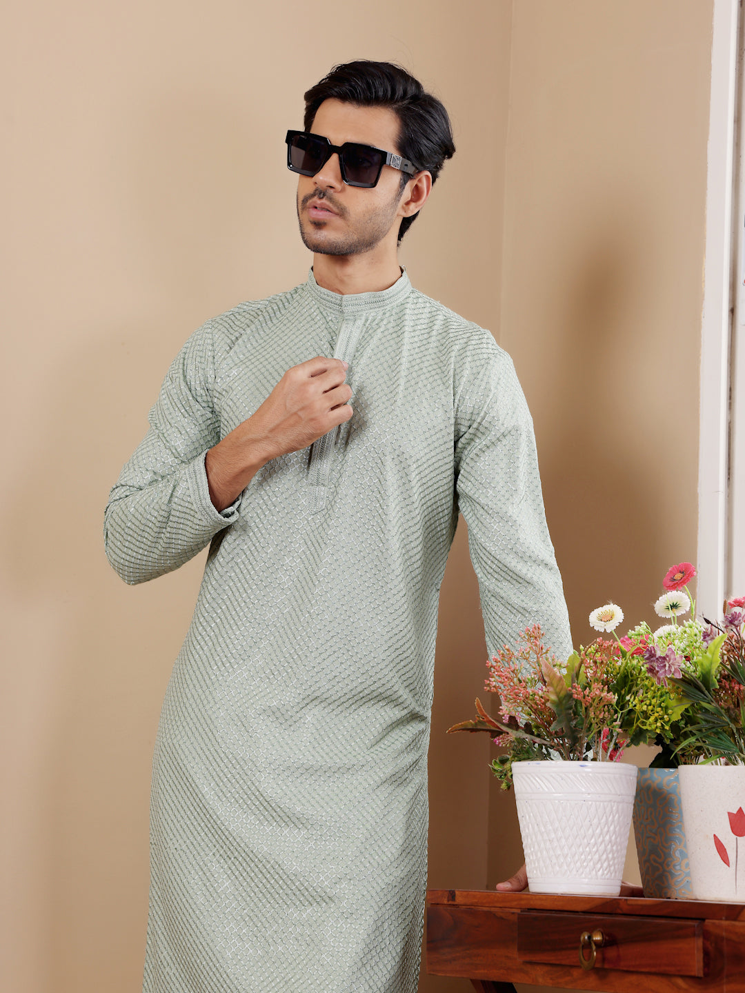 Men’s pastel green kurta set featuring elegant Chikankari embroidery and comfortable art silk bottoms.