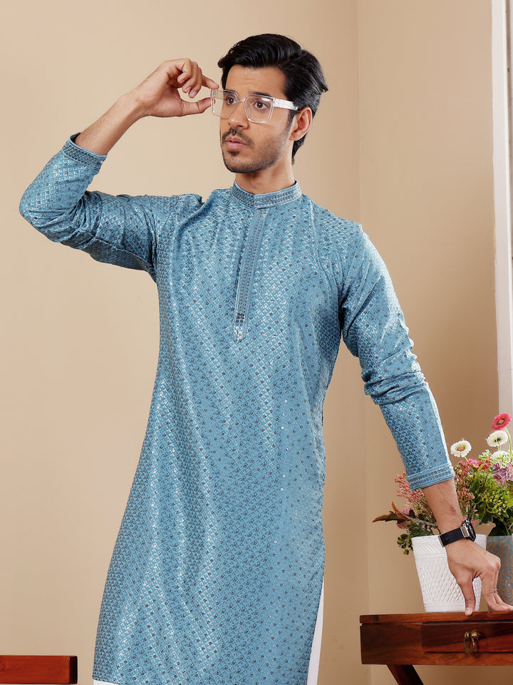 Elegant cyan blue kurta set for men featuring detailed Chikankari embroidery.