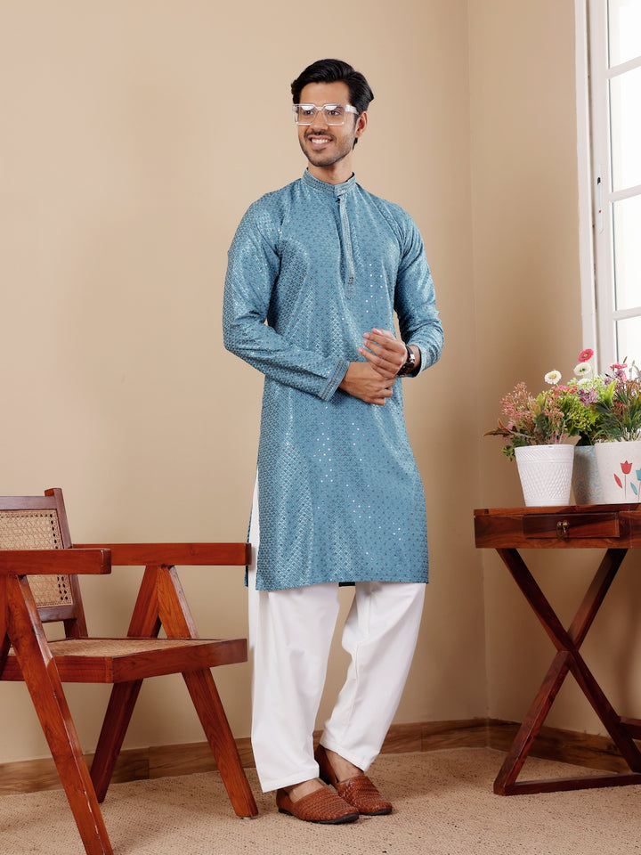 Cyan blue kurta set for men with fine Chikankari embroidery and art silk bottoms.