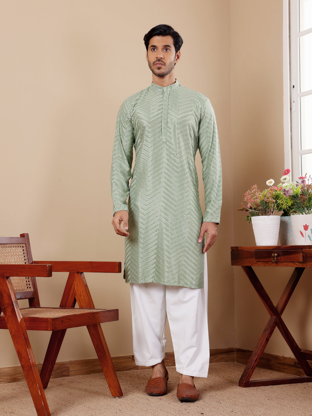 Elegant pastel green Viscose kurta set with delicate Chikankari detailing and handwoven motifs.