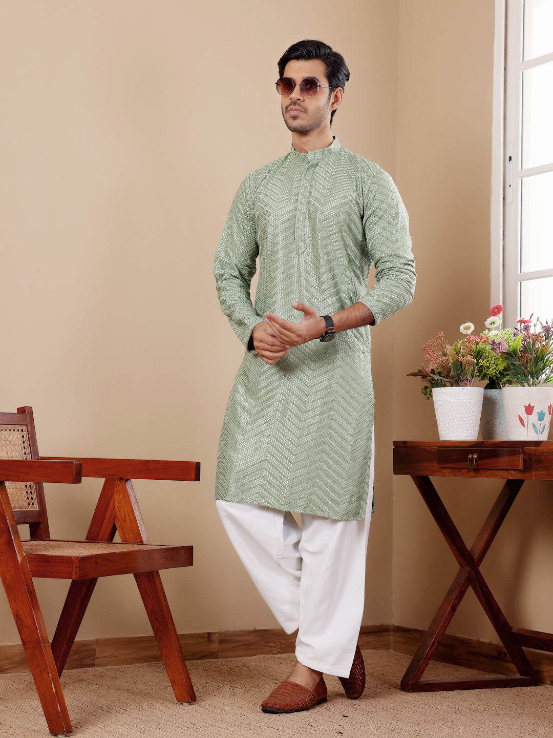 Handcrafted pastel green kurta set with exquisite Chikankari work and handwoven motifs for men.