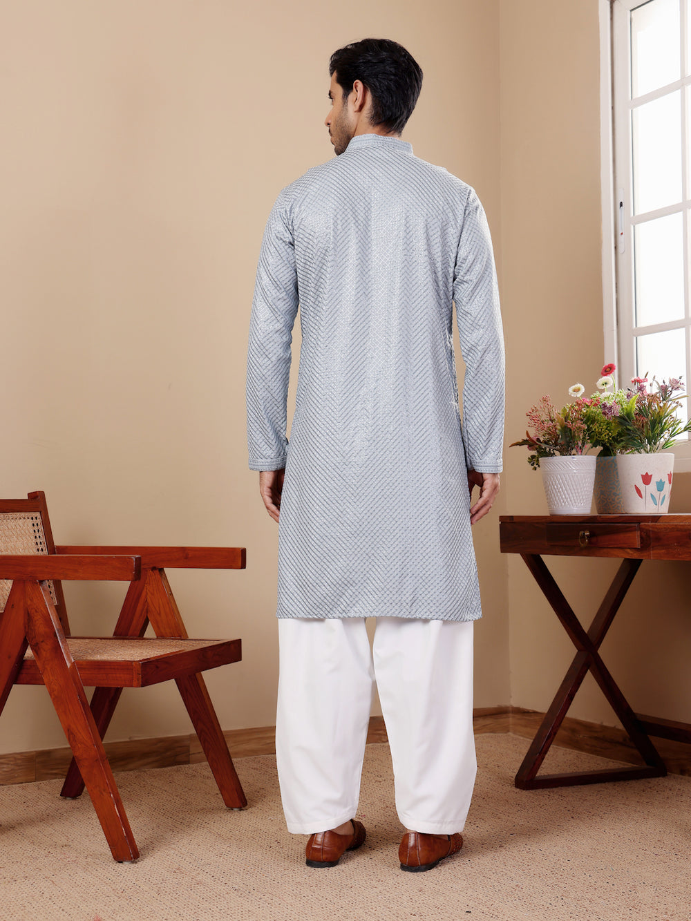 Elegant baby blue Viscose kurta set with handwoven Chikankari detailing and art silk bottoms for men.