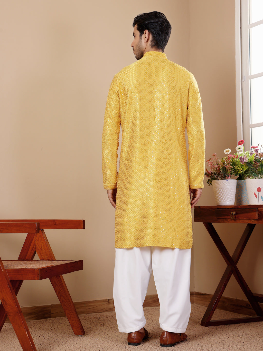 Elegant yellow kurta for men with intricate Chikankari work and breathable viscose fabric.