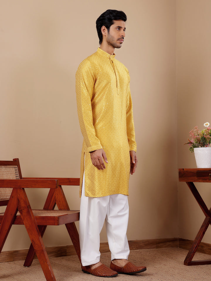 Stylish yellow kurta set with fine embroidery, ideal for family gatherings.