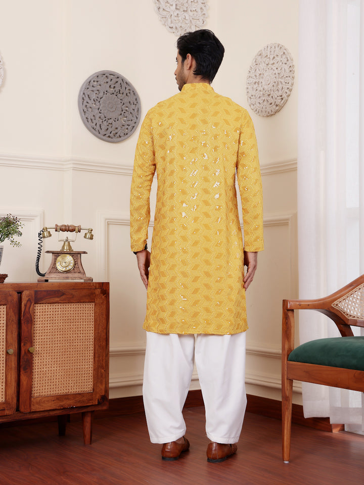 Elegant yellow Viscose kurta with detailed Chikankari embroidery and art silk bottoms.