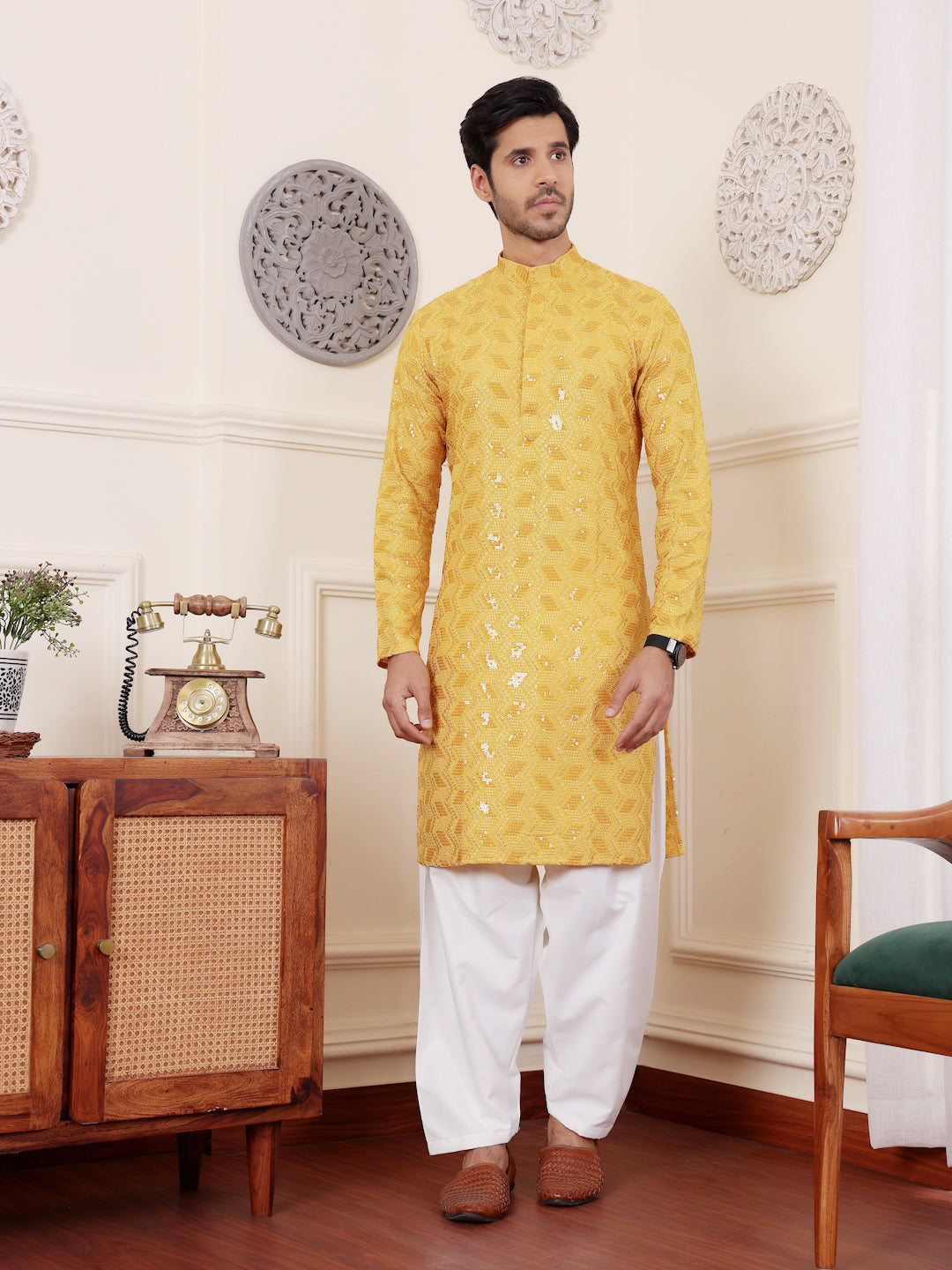 Traditional yellow kurta set for men with Chikankari embroidery and luxurious art silk bottoms.