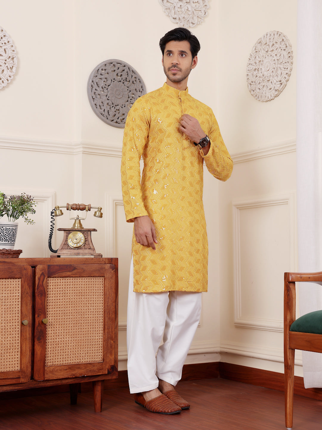 Soft yellow kurta with Chikankari work and art silk bottoms, ideal for weddings and festivals.