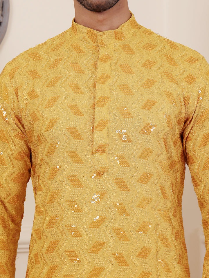 Yellow kurta for men with delicate Chikankari embroidery and sophisticated art silk bottoms.