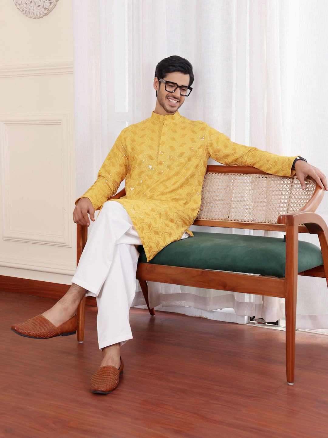 Men’s yellow kurta with fine Chikankari embroidery and soft art silk bottoms, perfect for cultural events.