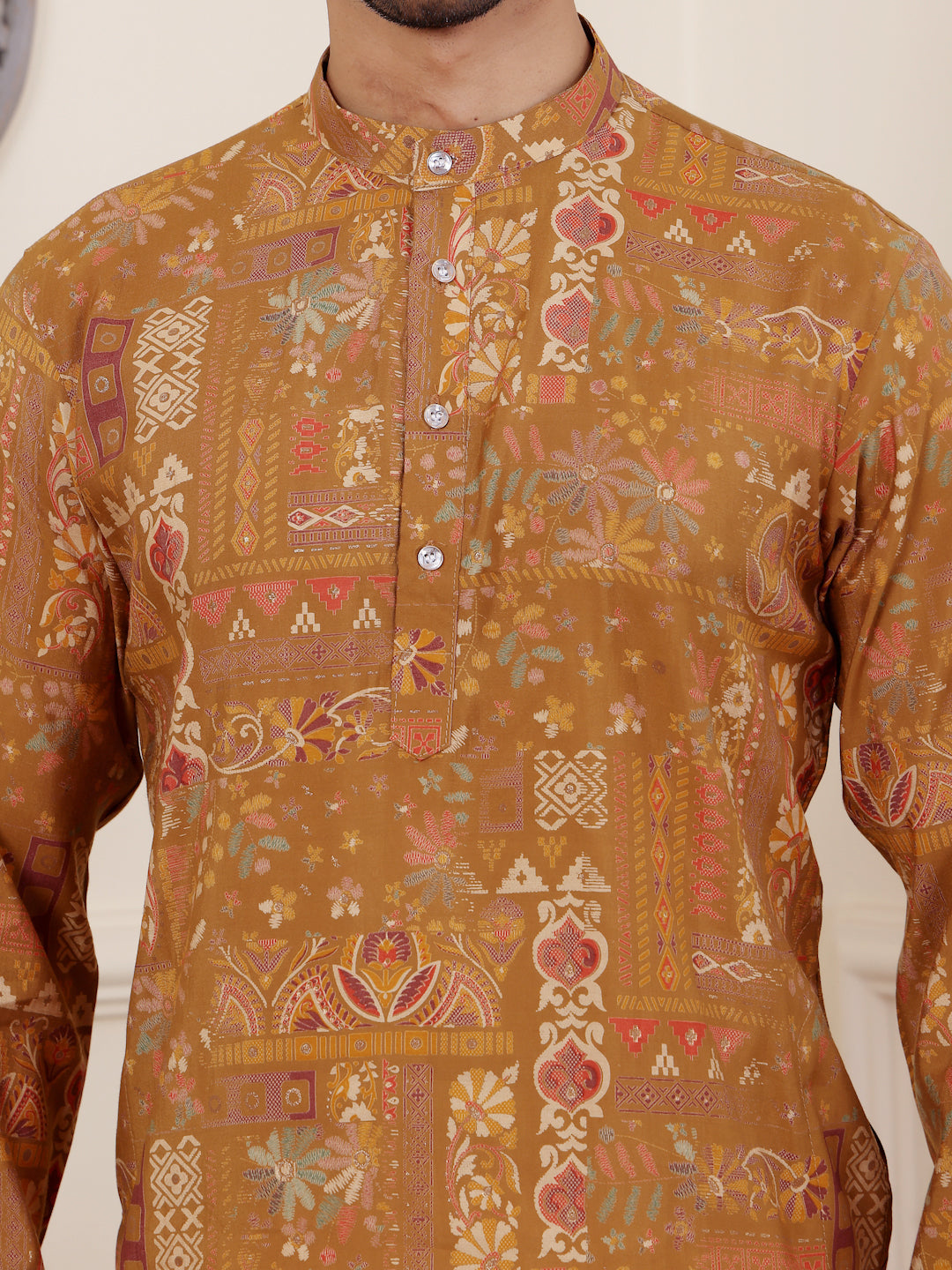 Stylish brownish yellow kurta set for men with intricate mil dye embroidery.
