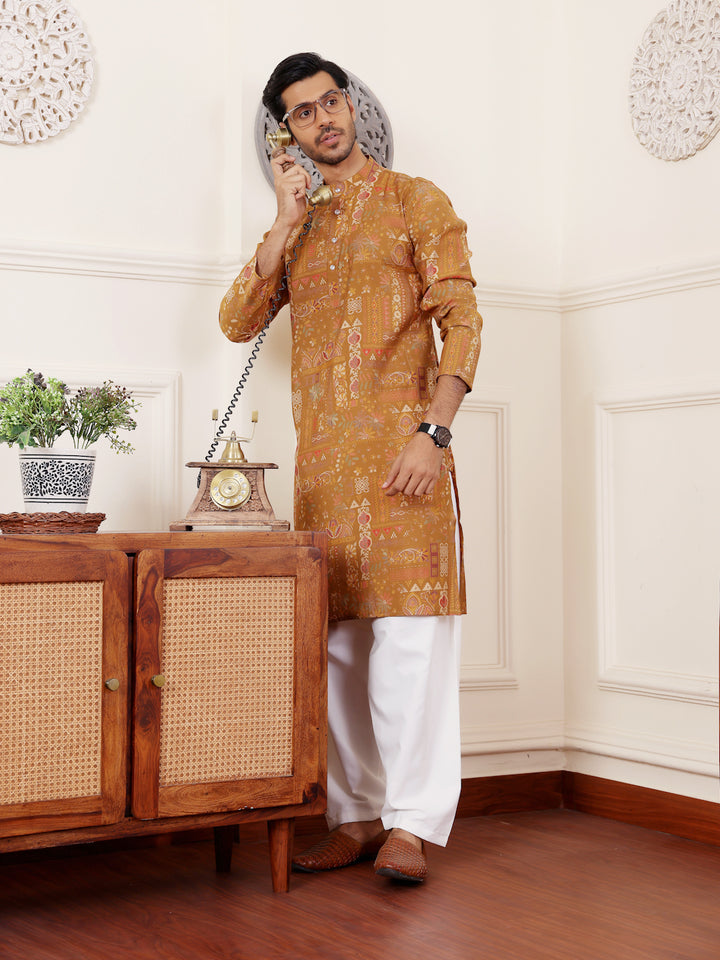 Traditional brownish yellow embroidered kurta pajama set for men’s wear.
