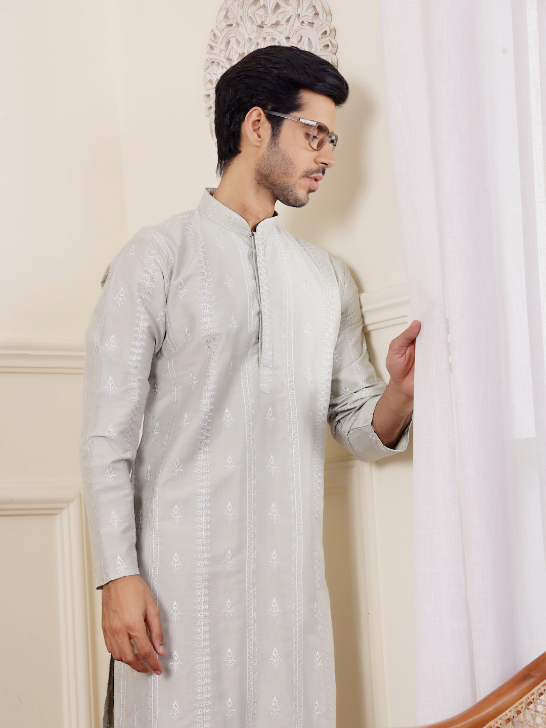 Festive light green kurta set for men with artisanal handwoven patterns and modern appeal.