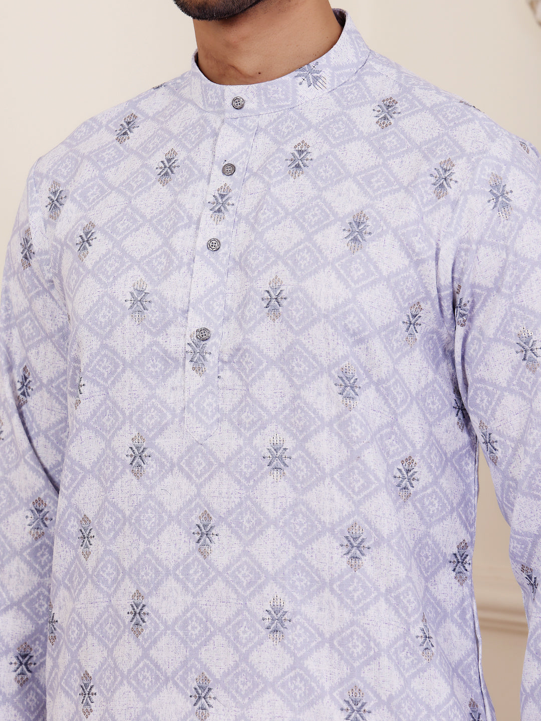 Close-up of a light purple cotton kurta with intricate weaved motifs detailing.