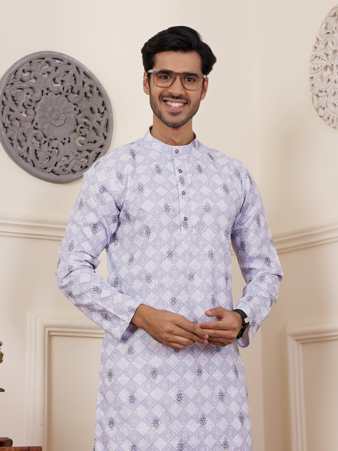 Classic light purple kurta with weaved detailing displayed in a well-lit festive setting.