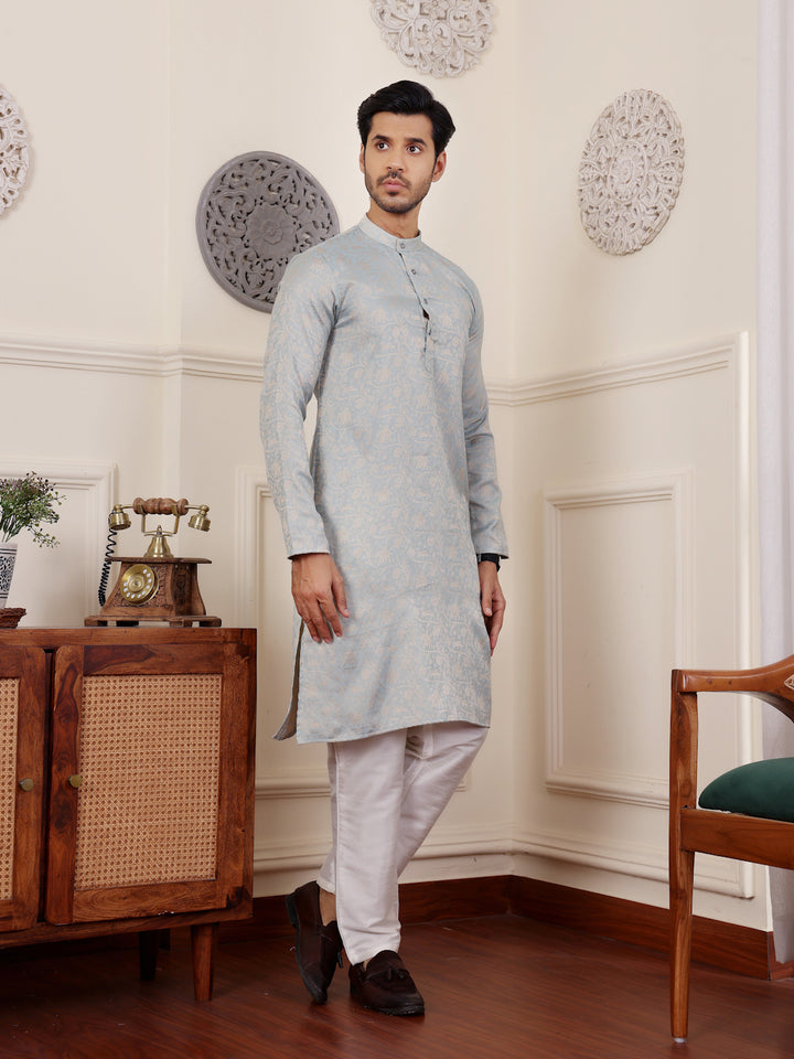 Light blue festive kurta for men featuring sophisticated beige motif detailing.