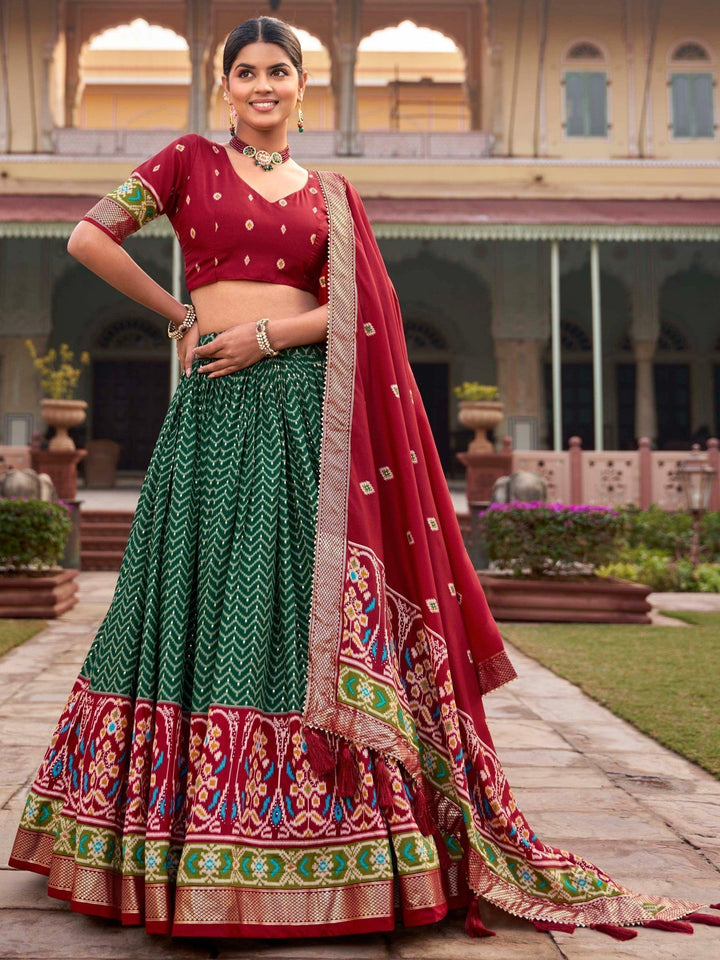 Customizable Green Silk Lehenga Choli | Flattering Fit with Patola Work and Dupatta