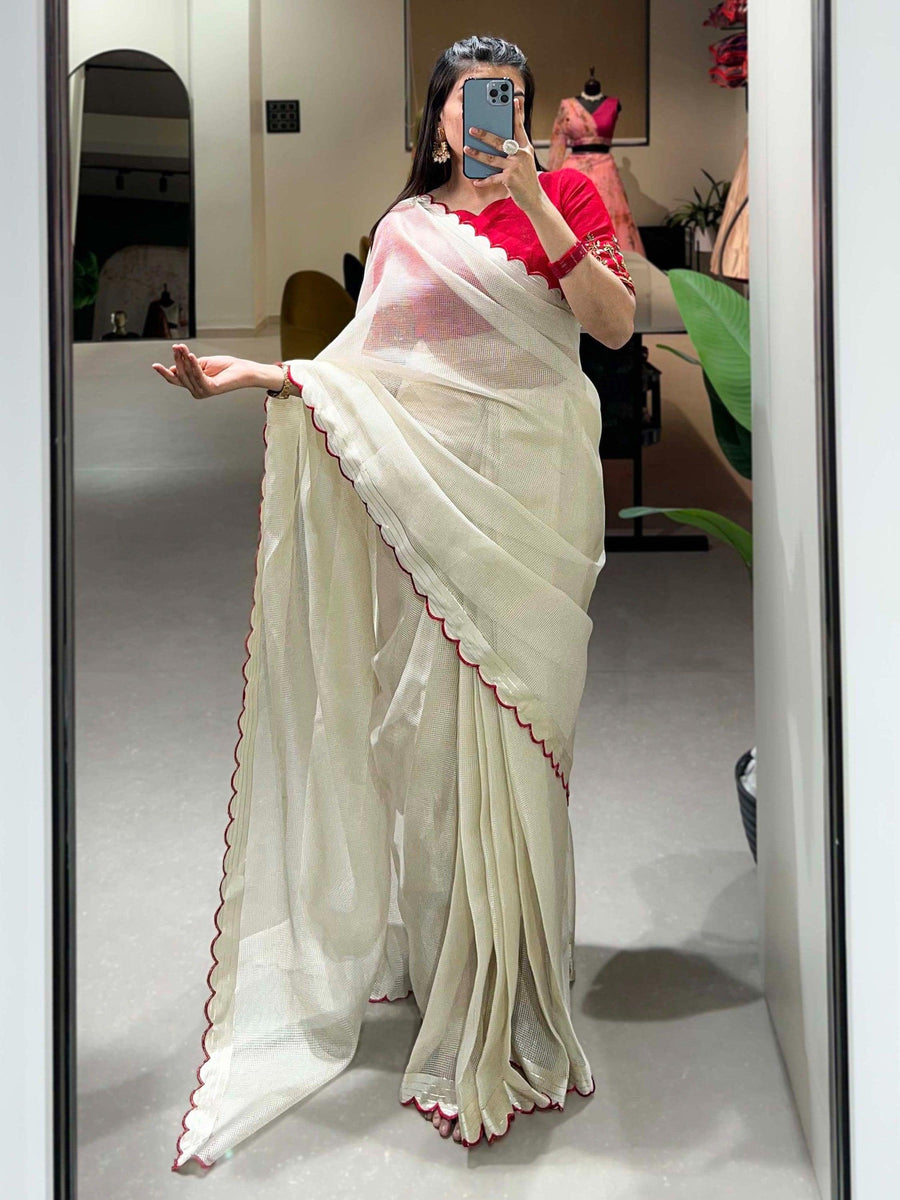 Red luxurious fabric saree crafted for elegance and style.