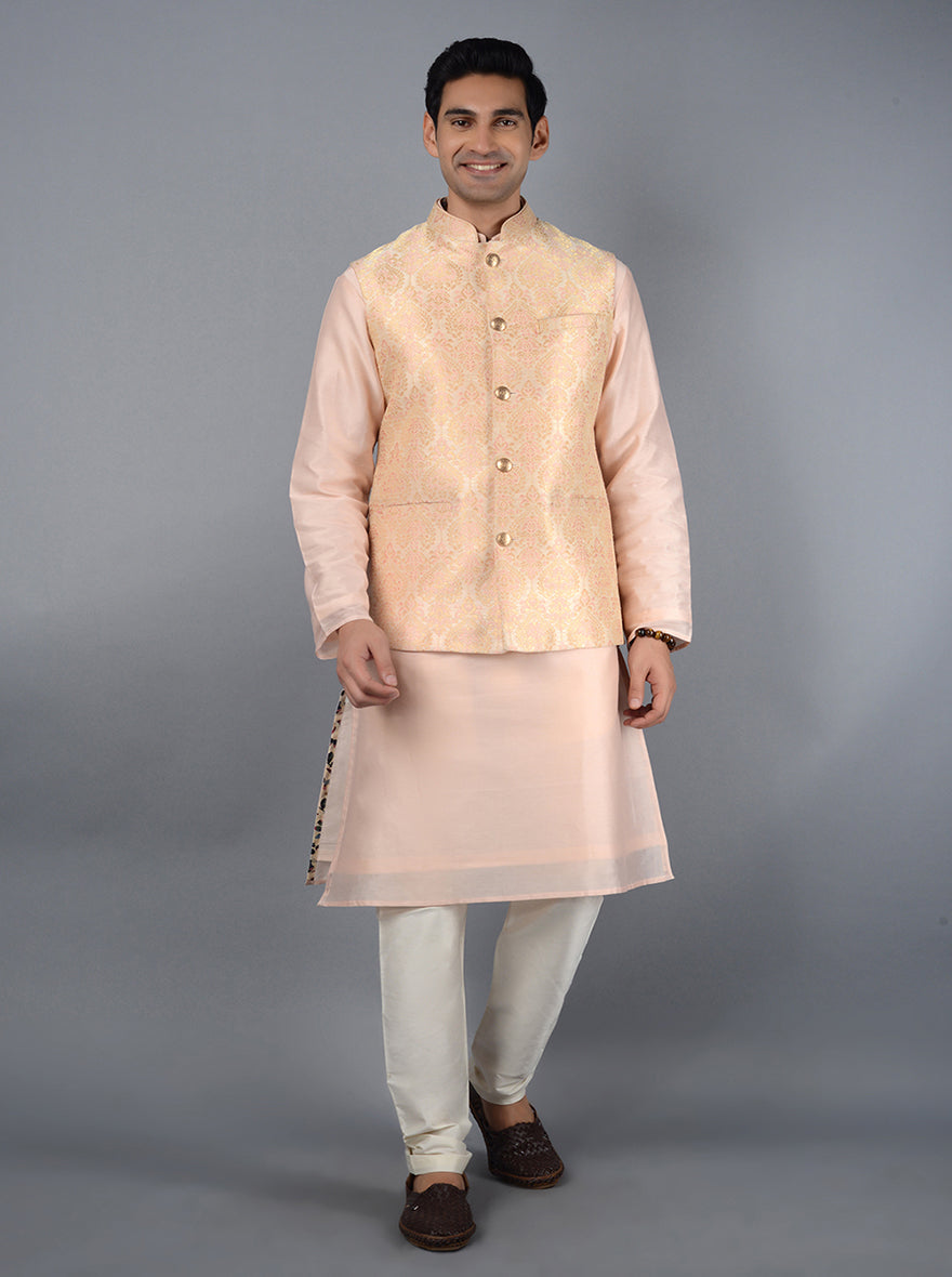 This cream and peach Bandhgala jacket showcases exquisite craftsmanship, perfect for special celebrations.