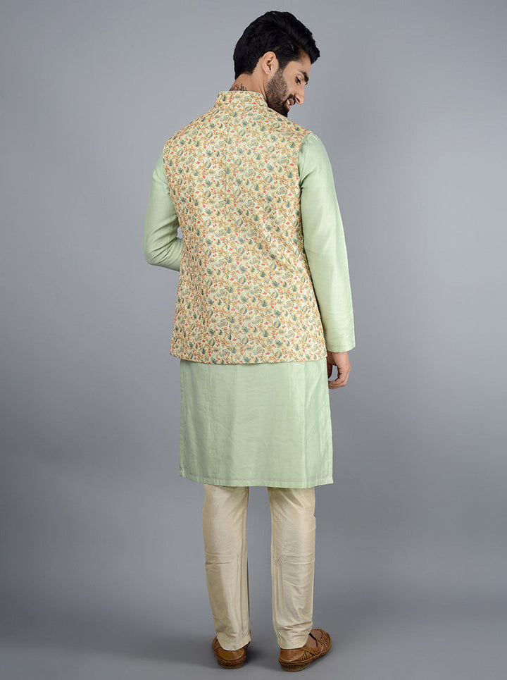 Stylish pista green bandhgala jacket for men, designed with premium silk blend and abstract print, perfect for pooja and festive events.