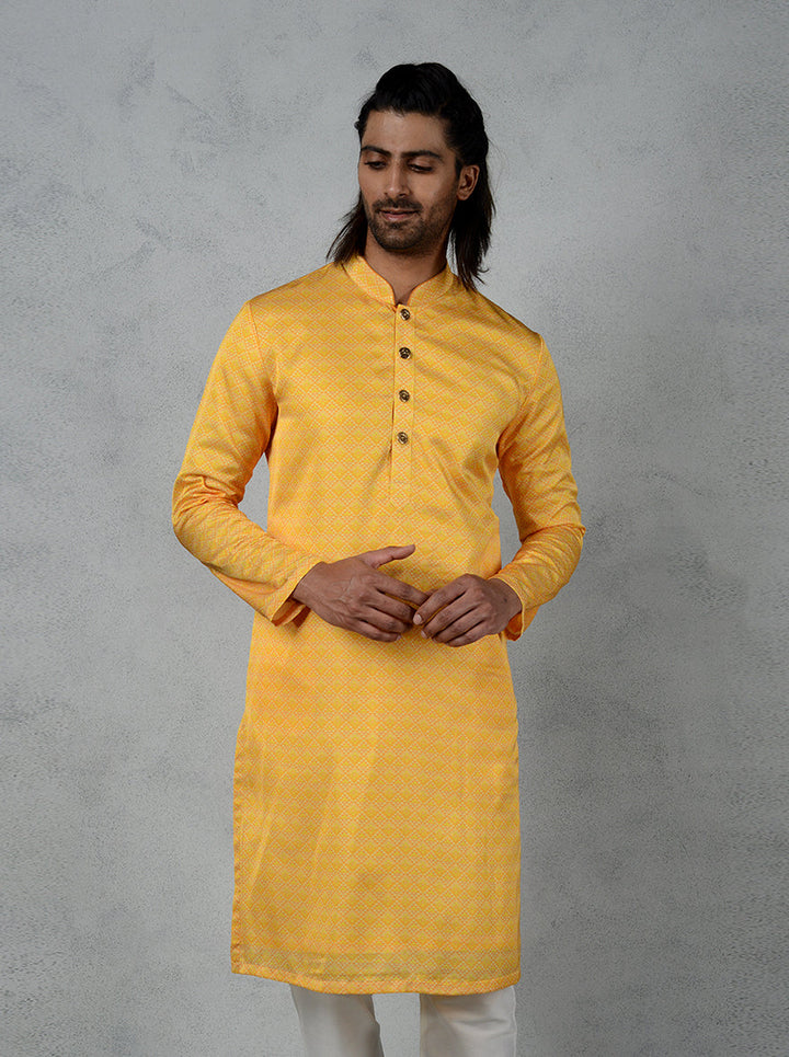 Bright yellow kurta pajama with gold button details, a USA festive essential.