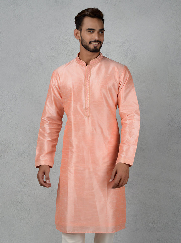 Discover the charm of this peach silk kurta set, crafted for special occasions and festive celebrations.