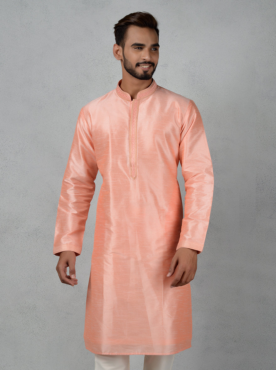 This stylish peach kurta pajama ensures you’re the center of attention at traditional events.