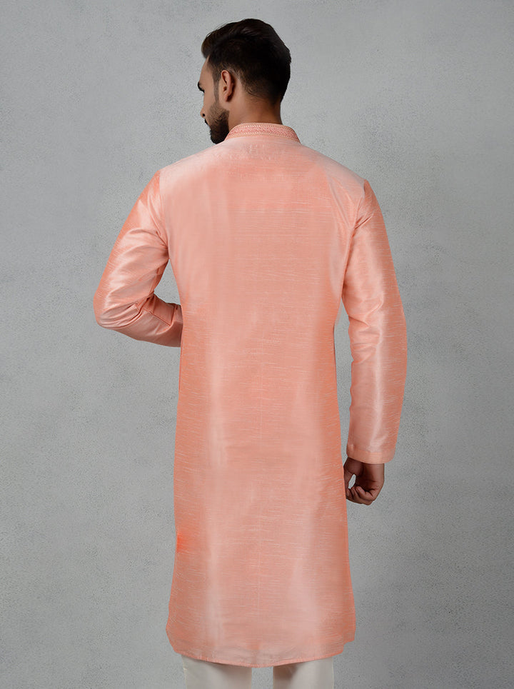 Perfect for pooja events, this peach silk kurta pajama combines elegance and comfort seamlessly.