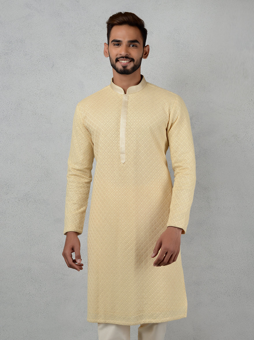 Discover the charm of this beige kurta pajama, designed for modern men attending traditional gatherings.