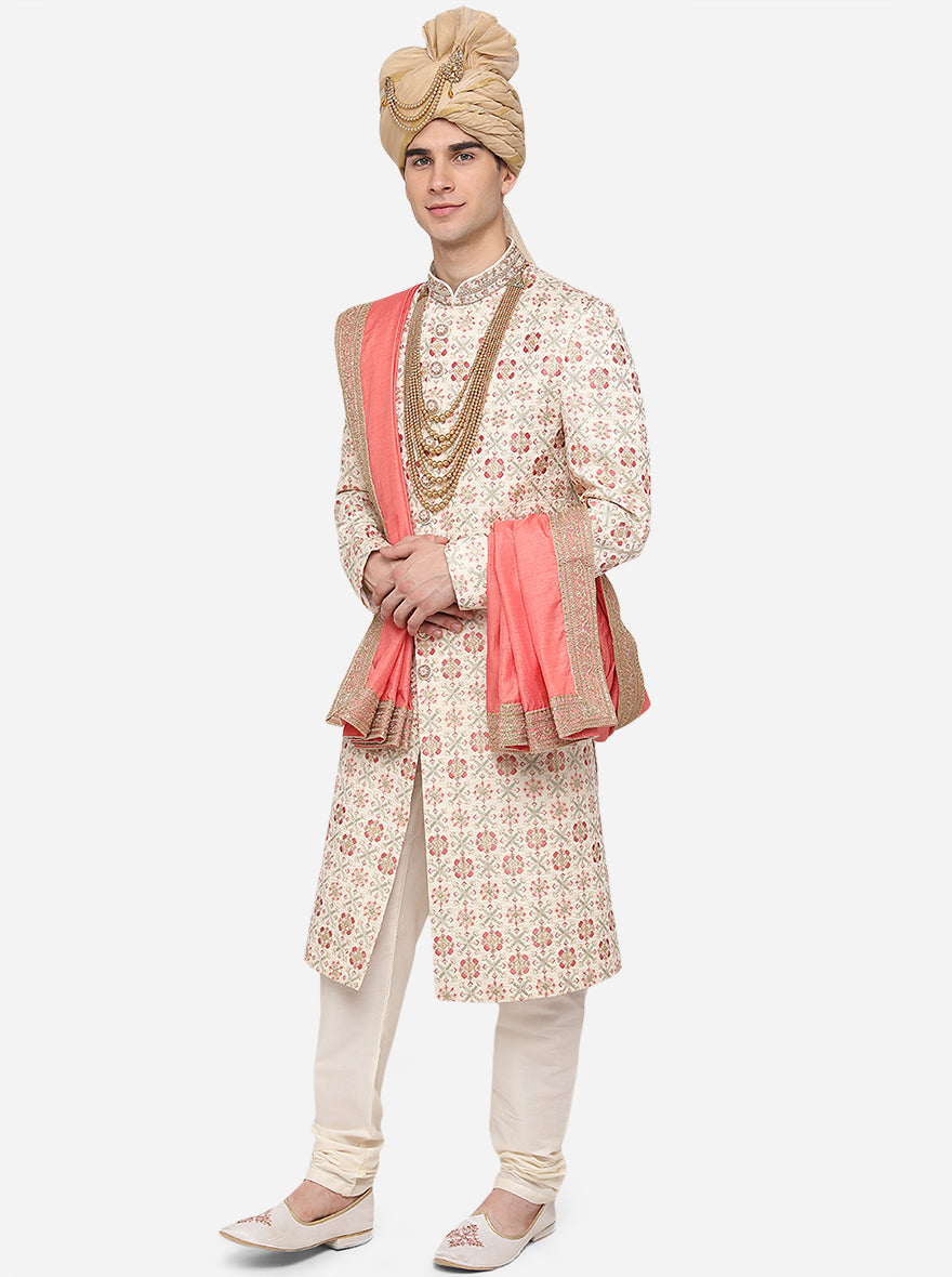 Crafted from premium poly silk, our cream Sherwani boasts exquisite embroidery for a sophisticated touch.