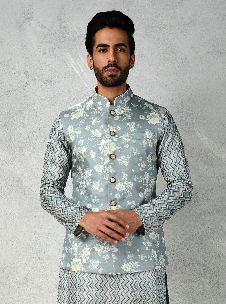 Mint green bandhgala jacket featuring botanical prints and mop buttons, adding sophistication to any occasion.