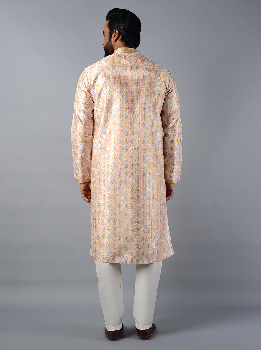 Experience sophistication and comfort with our beautifully crafted peach kurta set for special occasions.