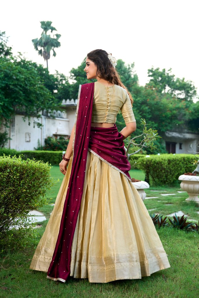 Traditional cream Kanchipuram lehenga with detailed embroidery, perfect for weddings.