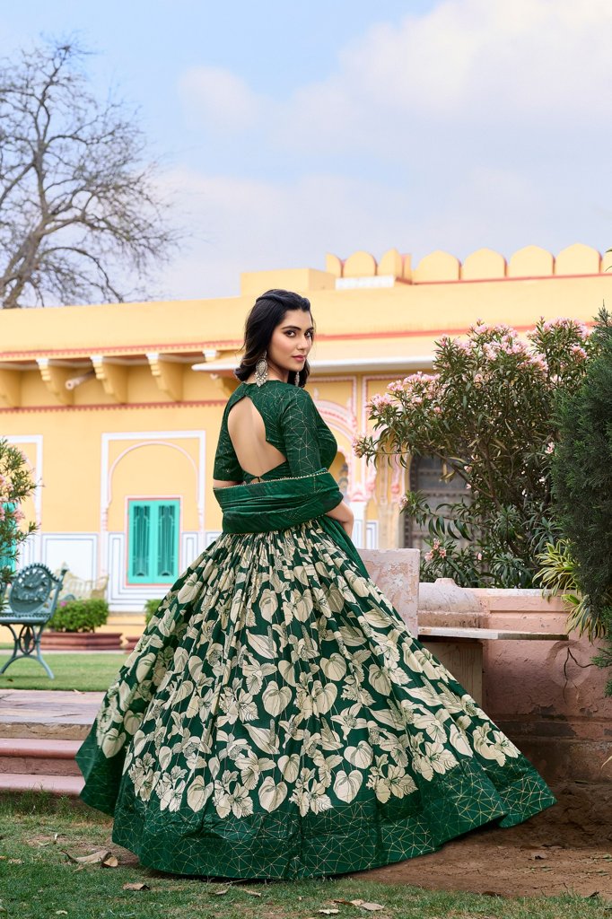 Stunning green floral Tussar silk lehenga with intricate foil print and trendy tassel details.