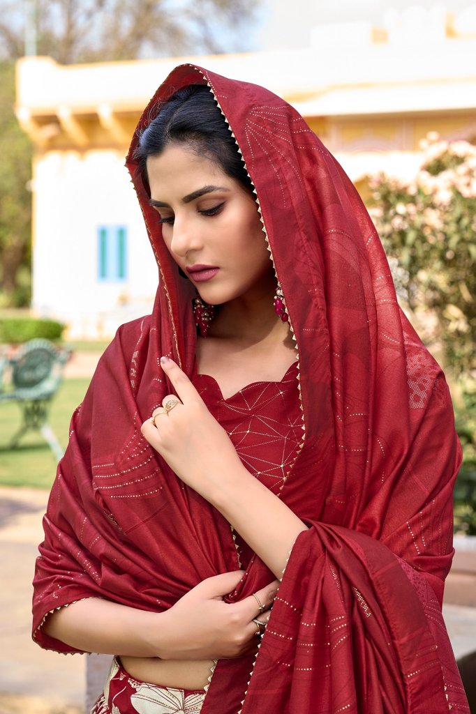 Stunning red Tussar silk lehenga with foil print, intricate floral motifs, and zip closure.