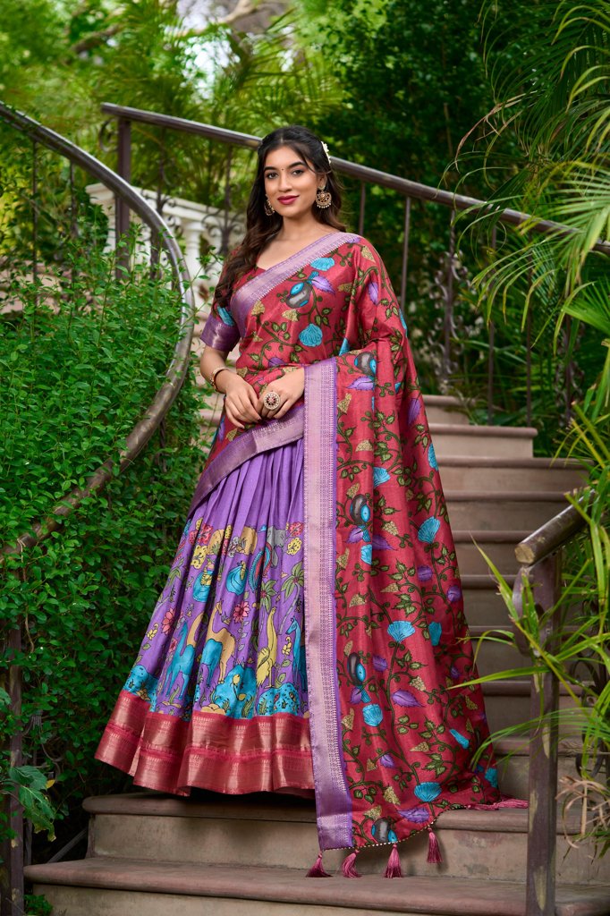 Elegant lavender dream Kalamkari print Dola silk lehenga set with rich floral motifs for festive occasions.