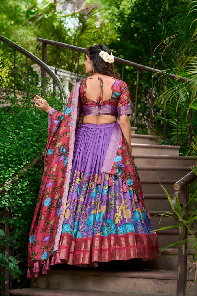 Stunning lavender Dola silk lehenga with Kalamkari prints and silk blouse, perfect for weddings.