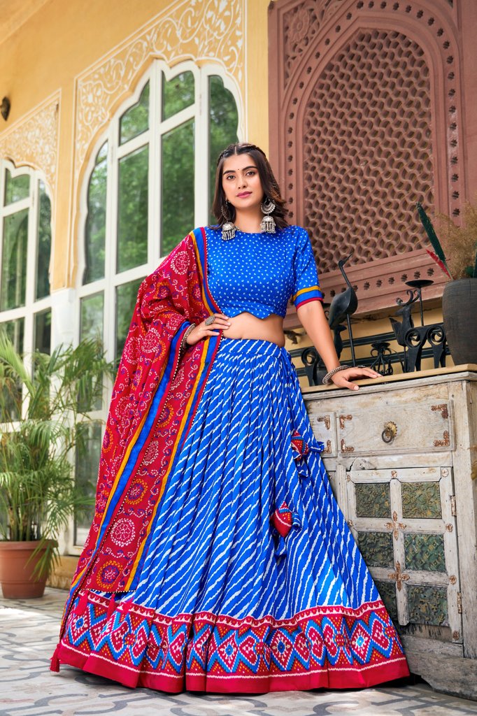 Stunning royal blue Tussar silk lehenga set with Leheriya pattern and vibrant Patola border.