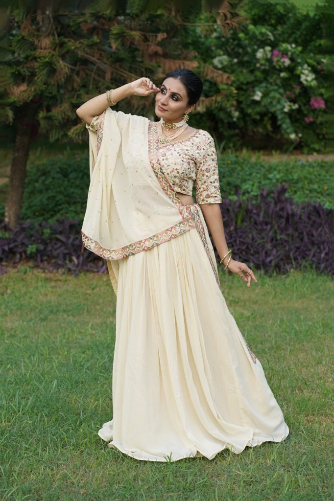 Stylish cream lehenga with delicate thread embroidery, paired with vichitra silk dupatta, ideal for USA festivities