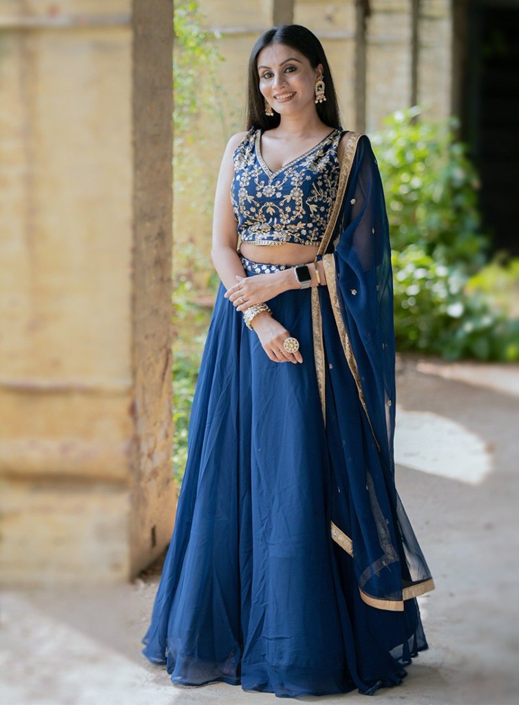 Elegant blue georgette lehenga set with intricate embroidery and sequins, perfect for USA weddings and festive occasions