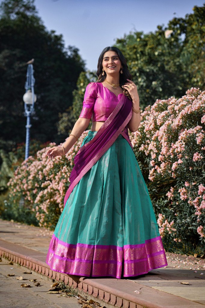 Elegant sky-blue Kanchipuram lehenga set with intricate zari weaving and a georgette dupatta for bridal wear.