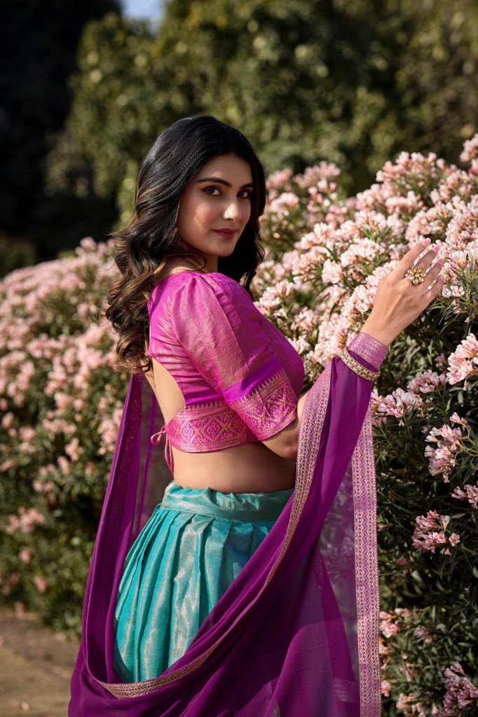 Traditional sky-blue Kanchipuram lehenga set with beautiful zari weaving and georgette dupatta for festive events.