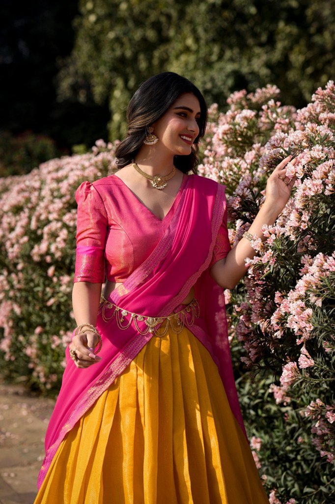 Traditional cream Kanchipuram lehenga with intricate zari work and georgette dupatta for cultural celebrations.