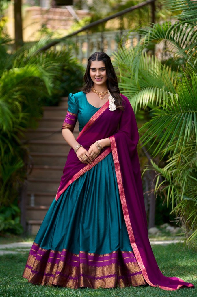 Traditional olive poly cotton lehenga with intricate zari work and a bright pink georgette dupatta for special events