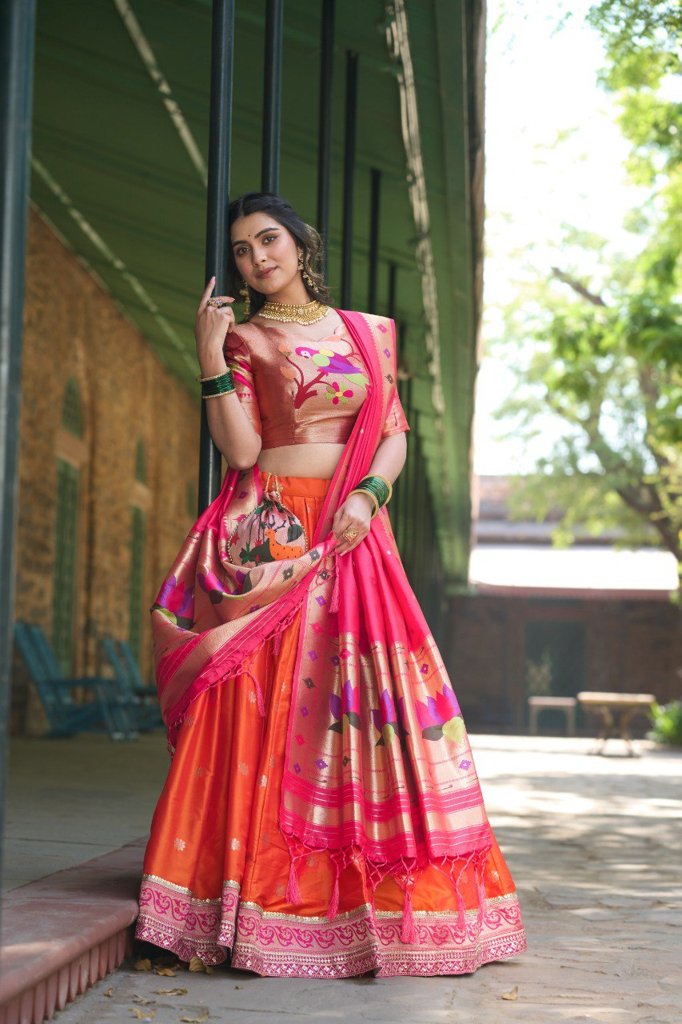 Stunning orange Paithani lehenga with jacquard silk fabric, featuring an exquisite dupatta and matching batwa for weddings.