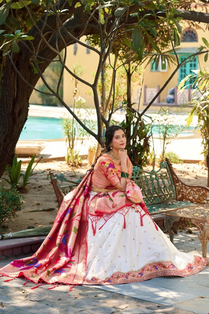 Gorgeous white Paithani lehenga set with jacquard silk fabric, paired with an ethereal dupatta and batwa for festive celebrations.