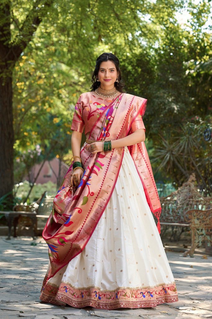 Beautiful orange Paithani lehenga in jacquard silk with intricate designs, paired with an ethereal dupatta and matching batwa.