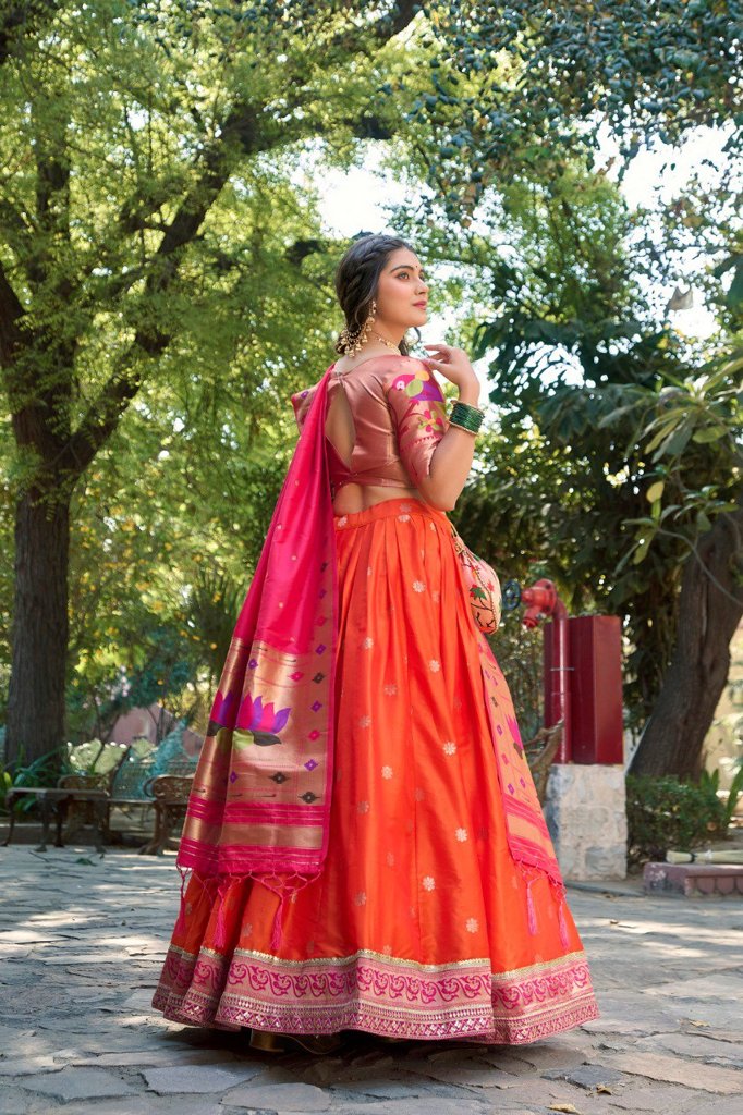 Elegant orange jacquard silk Paithani lehenga with stunning dupatta and batwa, ideal for bridal celebrations.